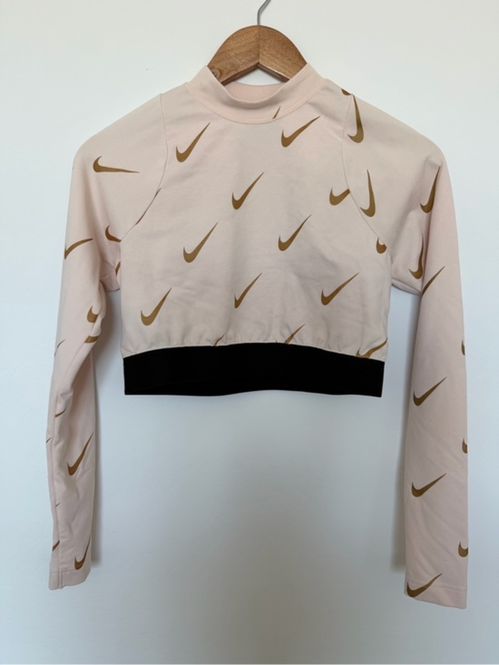 Nike Pale Pink Cropped Long-Sleeve Top with Gold Swoosh